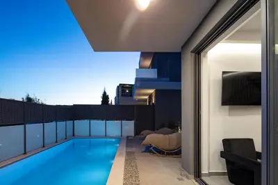 a swimming pool on the roof of a house at VillaSaints I Private Pool Villas, Walk to Beach, BBQ in Chania Town
