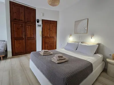 a bedroom with a bed with towels on it at Liva apartments in Chania Town