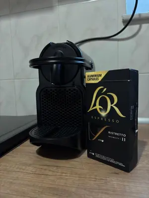 a black coffee maker and a box on a table at Lynne's Harmony Chania Beach Studio in Chania Town