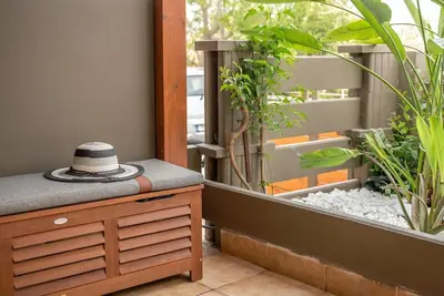 a hat sitting on top of a dresser in a garden at Modern Studio 2 with a Yard in Chania Town