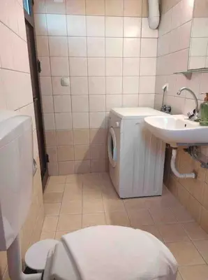 a bathroom with a toilet and a sink at Skaros Cottage in Chania Town