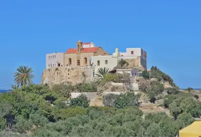 a castle on top of a hill with trees at VALENA STYLISH HOME (15 min TO ELAFONISI BEACH) in Élos