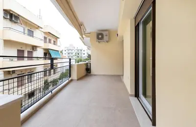 an empty corridor of a building with a balcony at CRETA ELENA SUITE in Chania Town