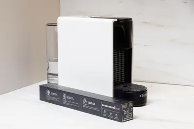 a black and white appliance on a counter with two boxes at CRETA ELENA SUITE in Chania Town