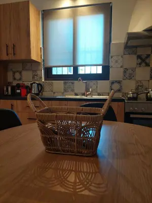 a basket sitting on top of a table in a kitchen at Elaion Apartments in Kántanos
