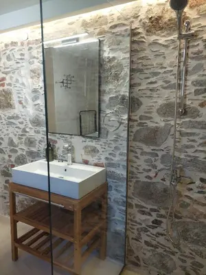 a bathroom with a sink and a shower at Elaion Apartments in Kántanos