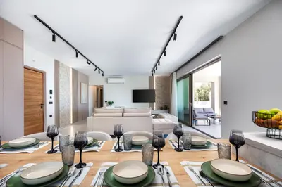 a living room with a couch and a table at Virtus in Mare in Tsivarás