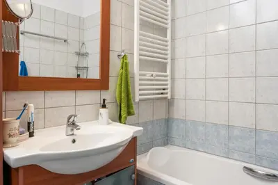 a bathroom with a sink and a bath tub at Urban Oasis Central in Chania Town