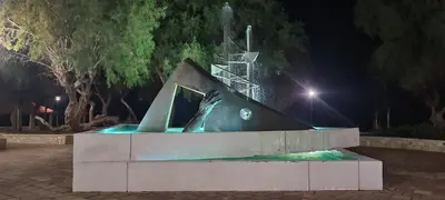 a fountain in a park at night at Old Town Loft with Sea View Roof Terrace and Private Parking in Chania Town