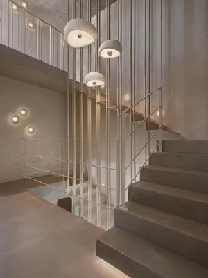a lobby with a staircase with lights and a stair case at Villa Albero - Sea View Escape in Souda