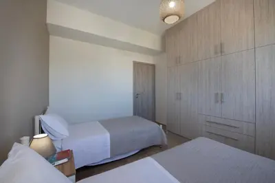 a bedroom with two beds and a large closet at FRDomus in Daratso