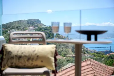a table and chairs with a view of a mountain at Nami Suites - Alenia in Chania Town