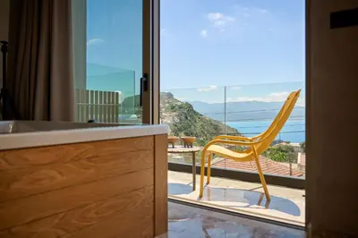 a bathroom with a sink and a large window at Nami Suites - Alenia in Chania Town