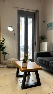 a living room with a couch and a coffee table at Duplex apartment city center in Chania Town
