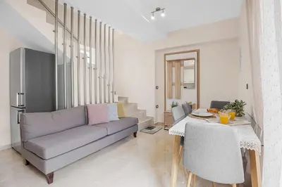a living room with a couch and a table at Park and sea view Villa with Private Pool 2 in Chania Town