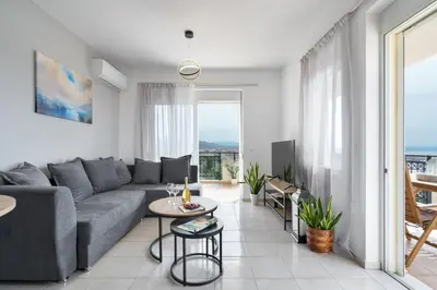 a living room with a couch and a table at Aelia Sea View in Chania Town