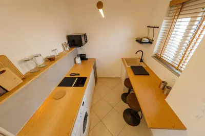 a kitchen with a stove and a counter top at El Chacha Studio in Galatás