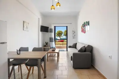 a living room with a couch and a table at Sun Beach Apartment in Chania 3 in Chania Town