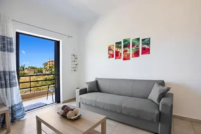 a living room with a couch and a table at Sun Beach Apartment in Chania 3 in Chania Town