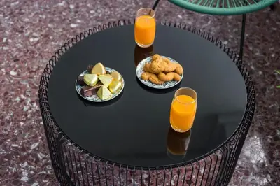 a table with a plate of food and two glasses of orange juice at Casa Αrezio in Chania Town