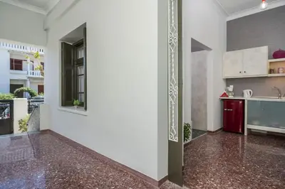 a kitchen with a white wall and a counter at Casa Αrezio in Chania Town