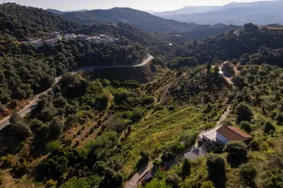an aerial view of a valley with a house at Iris Cretan Mountain Escape in Apothíkai
