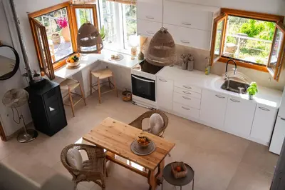 an aerial view of a kitchen with a table at Iris Cretan Mountain Escape in Apothíkai