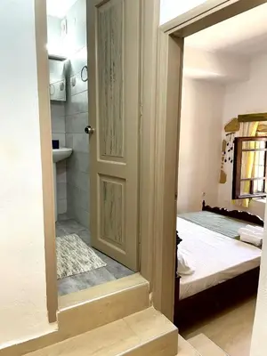 a door leading to a bedroom with a bed at Kyparissos Apartment II in Kissamos