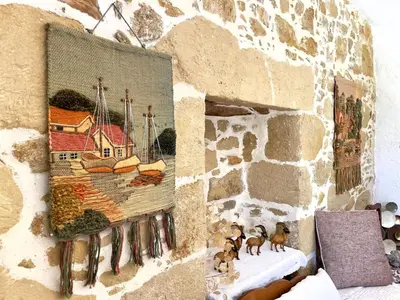 a painting on the wall of a stone wall at Kyparissos Apartment II in Kissamos