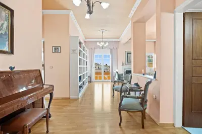 a living room with a piano and chairs at Artistic Apartment in Chania in Chania Town
