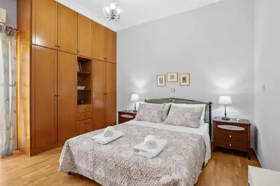 a bedroom with a bed with two towels on it at Artistic Apartment in Chania in Chania Town