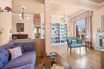 a living room with a purple couch and a chair at Artistic Apartment in Chania in Chania Town