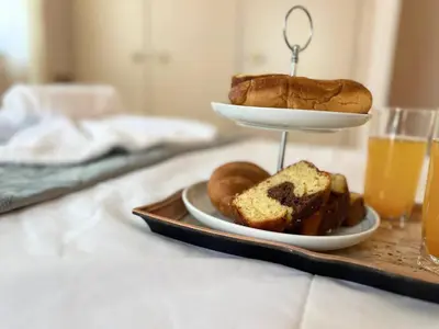 a plate of bread and pastries on a table at Sea Breeze Sanctuary-1bd 3pl 1ba - 90m To Sea in Chania Town