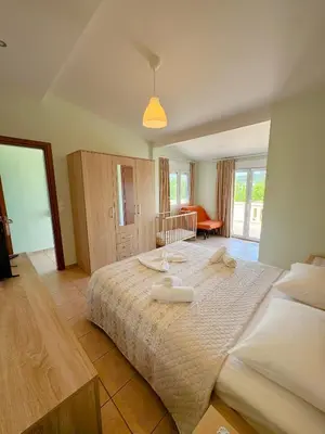 a bedroom with a large bed with towels on it at Villa Marianna Lygides in Ayiá