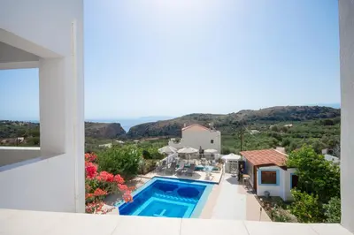 a view of a villa with a swimming pool at Infinity Wellness Boutique Hotel in Afráta