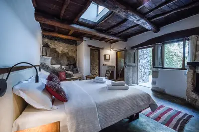 a bedroom with a large bed in a room at Μilia Mountain retreat in Vlátos