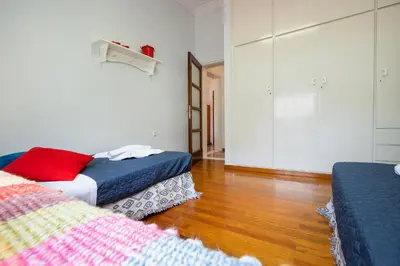 a room with two beds in a room at Clio Townhouse in Chania Town