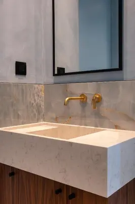 a sink in a bathroom with a mirror above it at Bouquet Luxury Rooms in Chania Town