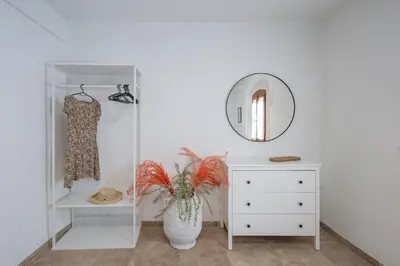 a dressing room with a dresser and a mirror at liofito village house in Pemónia