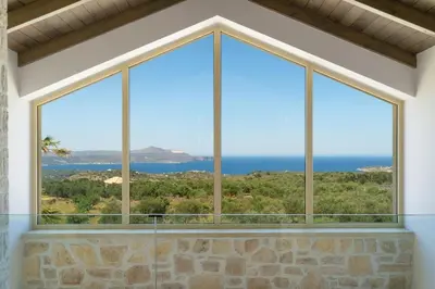 a window with a view of the ocean at Villa Athena - Crete Pickleball Paradise in Vamos