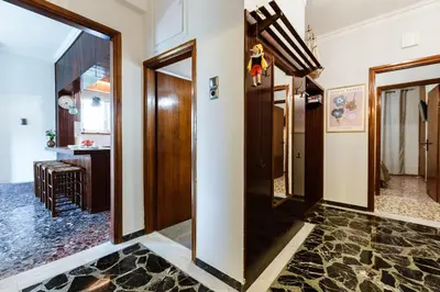 a hallway with wooden doors and a hallway with a room at Chania Dream House in Chania Town