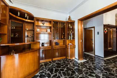 a home bar with wooden cabinets and a black floor at Chania Dream House in Chania Town