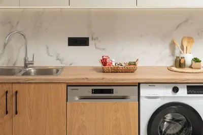 a kitchen with a sink and a dishwasher at Elia City Apartments in Chania Town