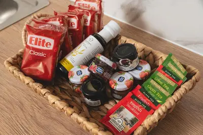 a basket filled with food and drinks on a table at Elia City Apartments in Chania Town