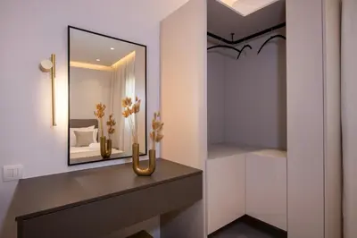 a dressing room with a mirror and a table at Tersus Luxury Villa in Kalyves