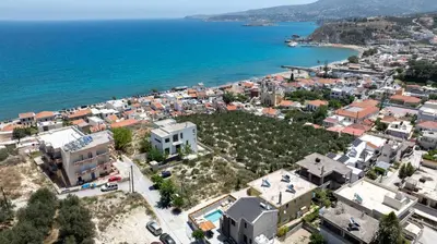 an aerial view of a city next to the ocean at Tersus Luxury Villa in Kalyves