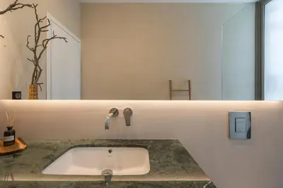 a bathroom with a sink in a counter at VILLA PETRA PHILIPPOS heated pool optional in Khámbatha