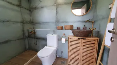 a bathroom with a toilet and a sink at Drop of Heaven in Katokhórion