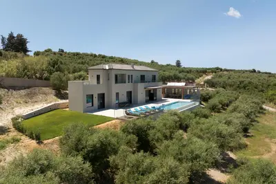 an aerial view of a house with a swimming pool at Blue Zone Villa, a SeaView Sanctuary with Pool, By ThinkVilla in Chania Town