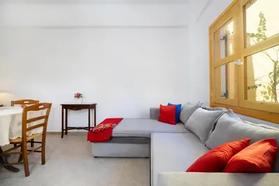 a living room with a couch and a table at Eleni Residences in Kalyves